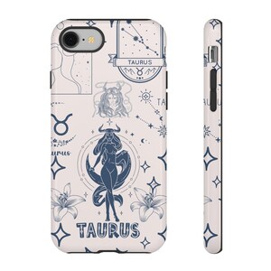 May include: A white phone case with a blue and white design featuring the zodiac sign Taurus. The design includes a constellation, a woman with horns, and the word "Taurus" repeated twice.