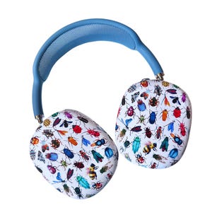 May include: Blue wireless headphones with a white design featuring a pattern of colorful insects.