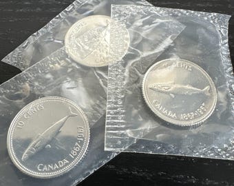 Moneda canadiense de 10 centavos de dólar de 1967, plata, sellada, sin circular (1 moneda por compra).