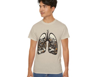 May include: A beige t-shirt with a black and white illustration of a forest scene inside a pair of lungs.