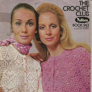 May include: Two women wearing crocheted sweaters. The woman on the left is wearing a white sweater with a white and pink polka dot scarf. The woman on the right is wearing a pink sweater. The text on the image reads "The Crochet Club Patons Book 943 Totem, Baroness Double Knit, Bluebell 35c"