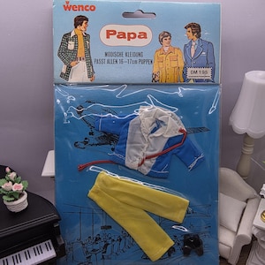 May include: Vintage doll clothing set in a sealed package. The package features illustrations of men's fashion and the word "Papa". The set includes a blue jacket, yellow pants, and black shoes. The package is blue and has the text "Wenco".