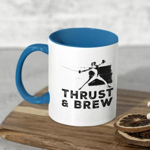 Thrust and Brew Coffee Mug | Fencing Mug | Gift for Fencer | Coffee Lover Gift | Funny Fencing Gift | 11oz/15oz | Color Options