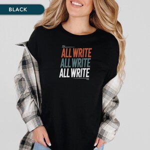 May include: Black t-shirt with the text "ALL WRITE" in orange, teal, and white stacked vertically. The shirt is worn with a plaid button-down shirt.