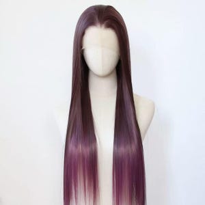 May include: A long, straight wig with a dark burgundy to purple ombre effect. The wig is styled with a center part and is displayed on a mannequin head. The hair has a natural-looking hairline and a smooth, sleek texture.