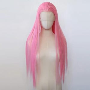 May include: A long, straight, bright pink wig with a lace front is displayed on a mannequin head. The wig has a natural-looking hairline and a center part. The hair is a vibrant, solid pink color and falls to the mid-chest.