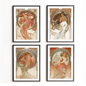 May include: Four framed art prints in the Art Nouveau style. Each print, in a black frame, showcases a woman with flowing hair and robes. The artworks use warm colours and decorative elements, reminiscent of Alphonse Mucha's style.