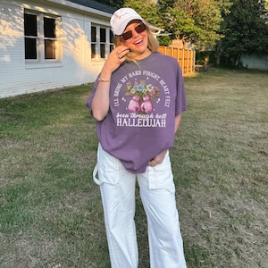 ハレルヤシャツ、地獄を通り抜けたクリスチャンTシャツ、信仰のグラフィックシャツ、イエス・ファイターTシャツ、彼女への贈り物、オーバーサイズの神は善良Tシャツ
