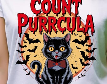 Może przedstawiać: Biała koszulka z kreskówkowym czarnym kotem w czerwonej muszce, otoczonym nietoperzami i napisem "Count Purrcula". Projekt jest osadzony na żółtym tle z czerwoną obwódką. Osoba nosi zielone okulary przeciwsłoneczne.