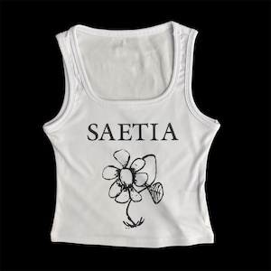 May include: White ribbed tank top with a black graphic of a flower and the word "SAETIA" printed on the front.