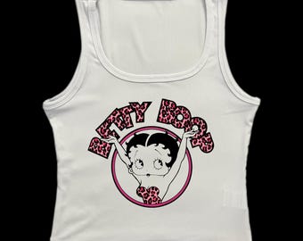 May include: White ribbed tank top with a pink and black leopard print graphic of Betty Boop with the text "Betty Boop" in a circle.