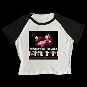 May include: White and black raglan crop top featuring a graphic from the band "From First to Last". The graphic includes the band's name and album art. The text "dear diary, my teen angst has a bodycount" is also visible.