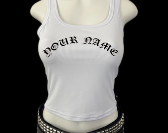 May include: White ribbed tank top with a black "YOUR NAME" inscription in a gothic font.