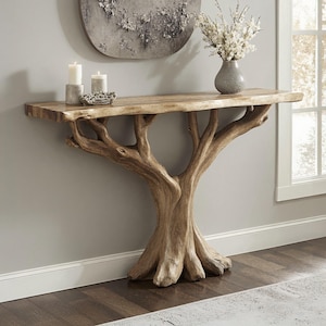 May include: A wooden console table with a tree trunk base and a natural wood top. The table has a rustic, organic look and would be a great addition to any home.