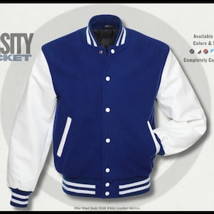 May include: A blue varsity jacket with white leather sleeves. The jacket has a button-up front, pockets, and a striped hem and cuffs. The text "VARSITY JACKET" is displayed on the upper left. The jacket is completely customizable and available in all colors and sizes.