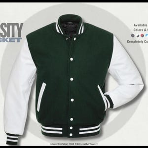 May include: A green varsity jacket with white leather sleeves. The jacket has a button-up front, white pockets, and a striped hem and cuffs. The text "VARSITY JACKET" is displayed on the left side. Available in all colors and sizes, completely customizable.