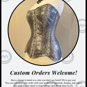 May include: A gray and silver snakeskin-patterned corset displayed on a mannequin. The corset has a structured, fitted design with a sweetheart neckline. The image is framed by a black circle and includes the text "Custom Orders Welcome!"