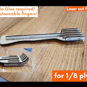 K&ouml;nnte beinhalten: Laserschnittdateien f&uuml;r einen Holzschlitten mit austauschbaren Fingern. Kein Kleber erforderlich. F&uuml;r 1/8 Zoll Sperrholz.