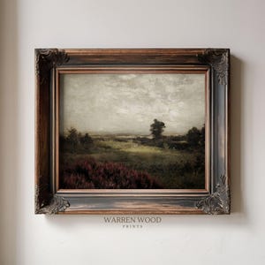 May include: An antique landscape painting in a dark, ornate wooden frame. The artwork depicts a field with a cloudy sky, featuring shades of green, brown, and purple. The text "WARREN WOOD PRINTS" is visible at the bottom.