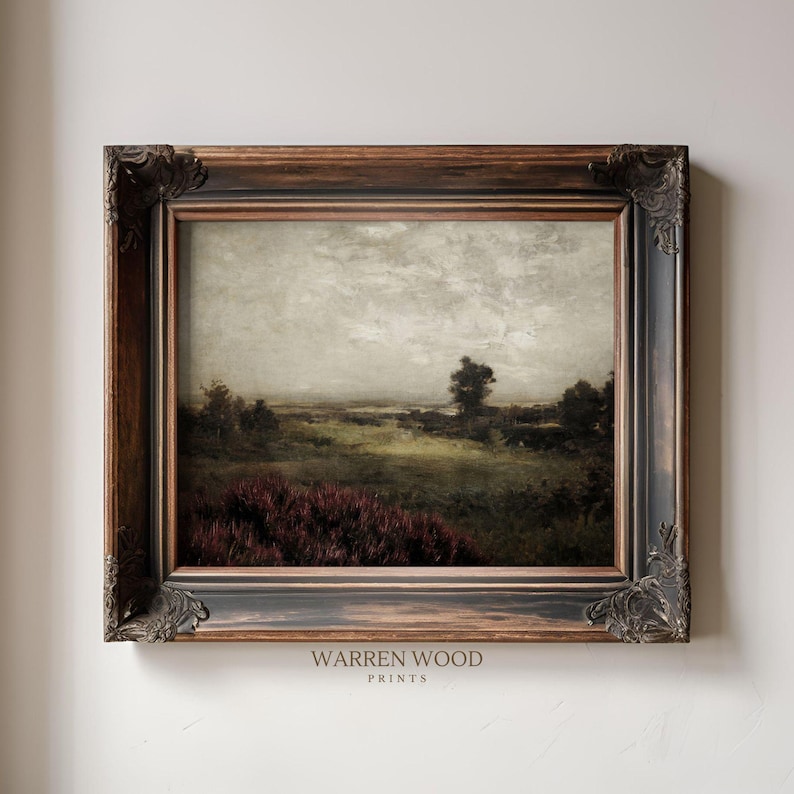 May include: An antique landscape painting in a dark, ornate wooden frame. The artwork depicts a field with a cloudy sky, featuring shades of green, brown, and purple. The text "WARREN WOOD PRINTS" is visible at the bottom.