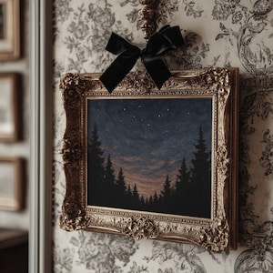 May include: A framed landscape painting with a gold ornate frame. The artwork depicts a forest silhouette against a twilight sky with visible stars. A black velvet bow is tied above the frame, adding a decorative touch.