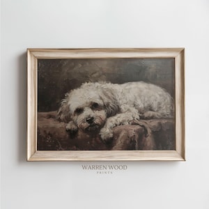 May include: A vintage framed painting of a white dog lying down on a brown patterned fabric. The dog has a sad expression and is looking down. The frame is a light wood color with a distressed finish.