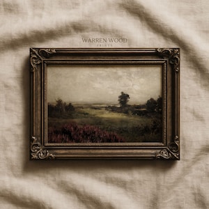 May include: A framed landscape painting with a dark brown ornate frame. The artwork depicts a field of red flowers and trees under a cloudy sky. The text "WARREN WOOD PRINTS" is visible at the top of the frame.