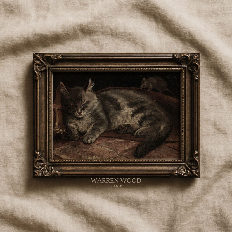 May include: A framed vintage print featuring a sleeping gray tabby cat and a small mouse. The artwork is in a dark, ornate frame. The print is signed "WARREN WOOD PRINTS".