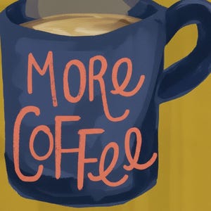 a blue mug with the text "More Coffee" written on it in orange cursive lettering.