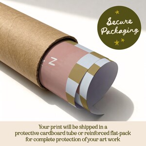 May include: A rolled print inside a brown cardboard tube. The print has a pink and gold chequered pattern. A green circle with the text "Secure Packaging" is visible. The letter "Z" is also visible.