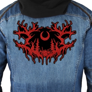 May include: Red embroidered patch with a black background featuring a crescent moon and two pine trees. The design is surrounded by a red, dripping, tree branch pattern.