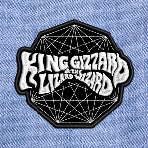 May include: Black and white embroidered patch with a geometric design and the text "King Gizzard & The Lizard Wizard".