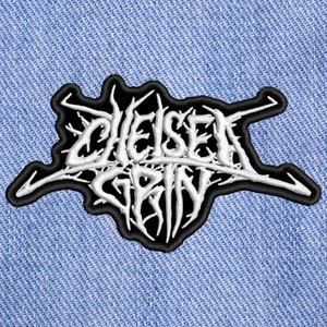 May include: Black and white embroidered patch with the text "Chelsea Grin" in a stylized font.