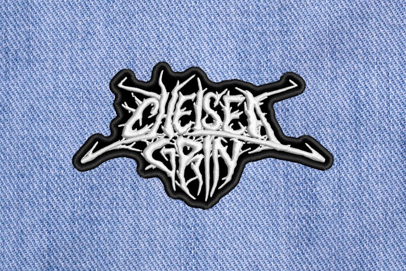 May include: Black and white embroidered patch with the text "Chelsea Grin" in a stylized font.