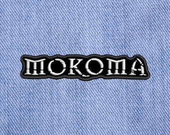Mokoma, écusson à coudre brodé.