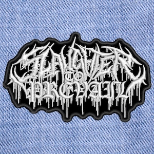 May include: White embroidered patch with the text "SLAVERY TO PREVAIL" in a black gothic font on a black background.