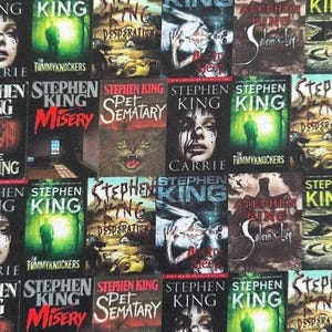 May include: A fabric pattern featuring multiple book covers by Stephen King. Titles include "Carrie," "Misery," "The Shining," and "Pet Sematary." The covers display various horror-themed illustrations and text, with a dark color palette.