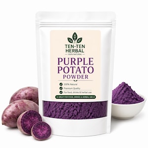 May include: A white packet of purple potato powder, labelled "Purple Potato Powder". Whole and sliced purple potatoes are in front of the packet, and a small bowl of powder is to the right.