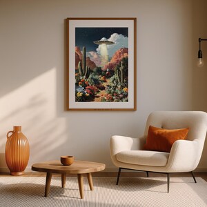 UFO cowboy sci-fi artwork framed in a beige living room with terracotta accents, cozy desert-inspired decor.