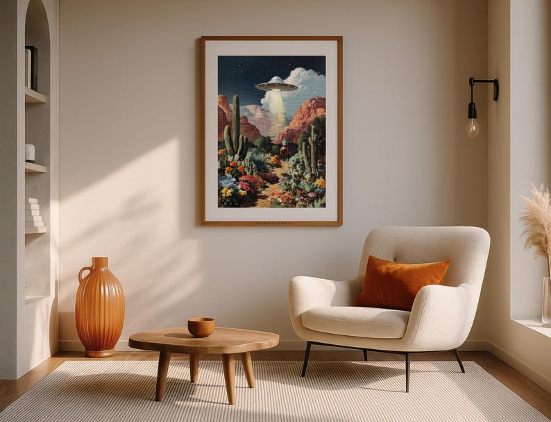 UFO cowboy sci-fi artwork framed in a beige living room with terracotta accents, cozy desert-inspired decor.
