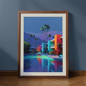 Puede incluir: Una impresión artística enmarcada que presenta una vibrante y colorida ilustración de una escena de resort. La obra de arte representa edificios en tonos naranja, verde azulado y rosa, palmeras y una piscina que refleja el cielo. La impresión está en un marco de madera marrón.