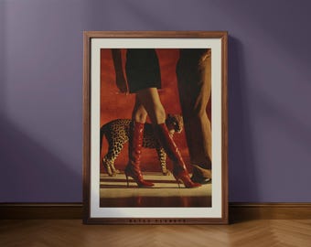 May include: Framed art print featuring a fashion-forward scene. A person in a black dress and red high-heeled boots walks alongside a leopard. The print has a red background and the text "RETRO PLANETS" at the bottom.