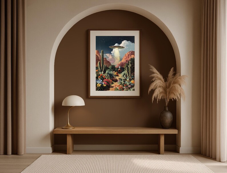 Southwestern UFO cowboy wall art framed inside an arched alcove with pampas grass and warm earthy tones.