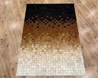 Patchwork tapijt rundleder met kleurverloop: zwart, bruin en wit