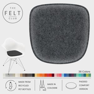 May include: A dark gray felt chair cushion with a rounded rectangular shape. The image includes a white chair with a black cushion, a color palette, and text that reads "THE FELT CLUB", "MADE FROM RECYCLED PET BOTTLES", and "MADE IN COLOGNE".