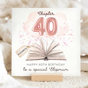 May include: A birthday card with the text "Chapter 40" and "Happy 40th Birthday to a special Stepmum." The card features a pink balloon shaped like the number 40, an open book, and a tag that says "Elizabeth."