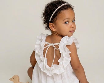 Combinaison pour le premier anniversaire d'une petite fille : tenue en coton smocké pour une séance photo « gâteau écrasé »
