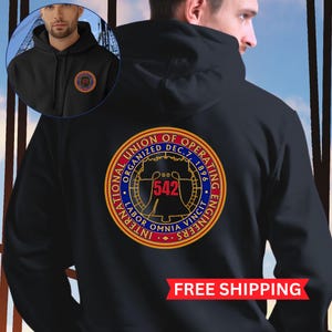 May include: Black hooded sweatshirt with a gold, red, and blue logo that reads "International Union of Operating Engineers Organized Dec. 7, 1896 Labor Omnia Vincit" with the number "542" in the center.