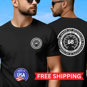 May include: Black t-shirt featuring a white circular logo on the front and back. The front logo includes the number 68 and text. The back logo reads "NATIONAL UNION OF OPERATING ENGINEERS" and "LABOR OMNIA VINCIT".