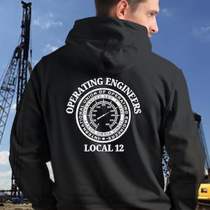 May include: Black hooded sweatshirt with a white graphic of a circular logo that reads "International Union of Operating Engineers Organized Dec. 7, 1896" with a gauge inside the circle and the text "Local 12" below the circle.